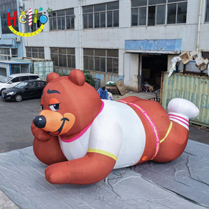 Mascotte gonflable géante en forme d'ours brun allongé avec ventilateur intégré et dimensions personnalisées pour les expositions dans les centres commerciaux - Product Image 1