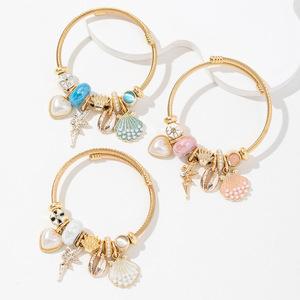 Bracciale in Acciaio Inossidabile Placcato Oro con Perle e Conchiglie, Personalizzato con Angelo dell'Amore, per Donna, 2026 - Product Image 1