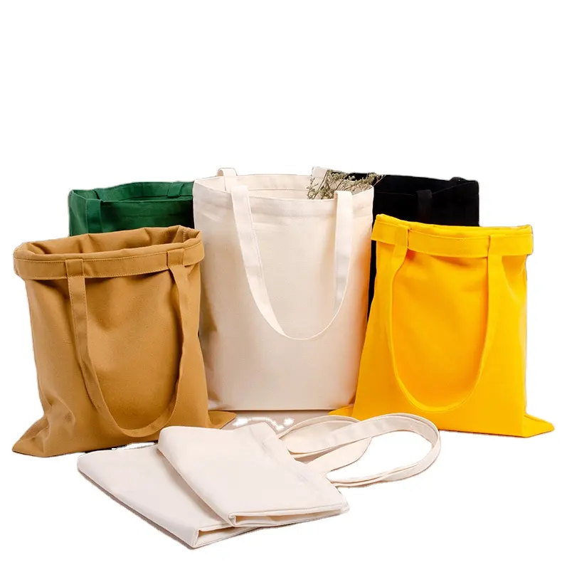 विज्ञापन हैंडबैग लोगो निर्माताओं थोक पोर्टेबल प्राकृतिक कपास ढोना बैग के साथ हल्के रिक्त थोक कपड़े बैग