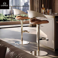 Tabouret de bar de luxe en métal rose doré avec siège en cuir rembourré, hauteur réglable, pour bar et restaurant commercial