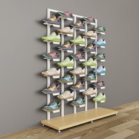 Support d'affichage de chaussures de sport en fer pliable et rotatif à une face, pour magasins de chaussures commerciaux, avec un design moderne et léger