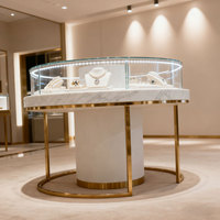 Vitrine de présentation de bijoux de luxe sur mesure, vitrine de comptoir en verre pour bijoux en or, vitrine de présentation de produits ronde en acier inoxydable