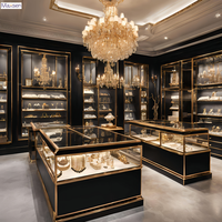 Comptoir de présentation de bijoux rectangulaire de luxe personnalisé en verre incurvé avec finition dorée Maxsen, éclairage LED, vitrine de magasin durable