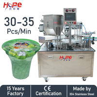 Remplissage de liquide de remplissage de granulés à double tête rotative et machine de thermoscellage de film en rouleau pour tasse en plastique PET PE PP