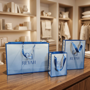 Bolsas de Papel Kraft Blancas de Lujo con Logotipo Personalizado, Asa de Listón Azul, Estampado en Caliente y Grabado, Bolsas de Compra Reutilizables Ecológicas - Product Image 2