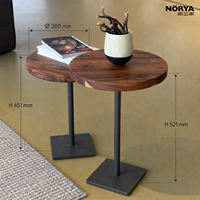 Table basse ronde moderne NORYA en noyer massif avec base sur pied foncé et plateau épais pour salon