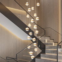 Lustre moderne d'escalier rond de luxe pour la suspension de lampe d'hôtel allume le lustre haut de plafond de la Chine