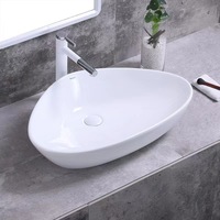 Lavabo de comptoir en céramique blanche de style nordique moderne haut de gamme avec une capacité de 12 L pour salle de bain
