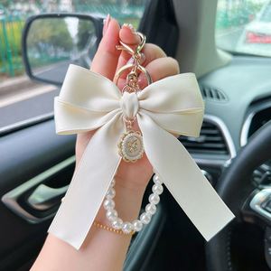 Porte-clés élégant avec nœud et perles pour femme, breloque de sac, support de clés de voiture avec pendentif, porte-clés féminin en soie - Product Image 2