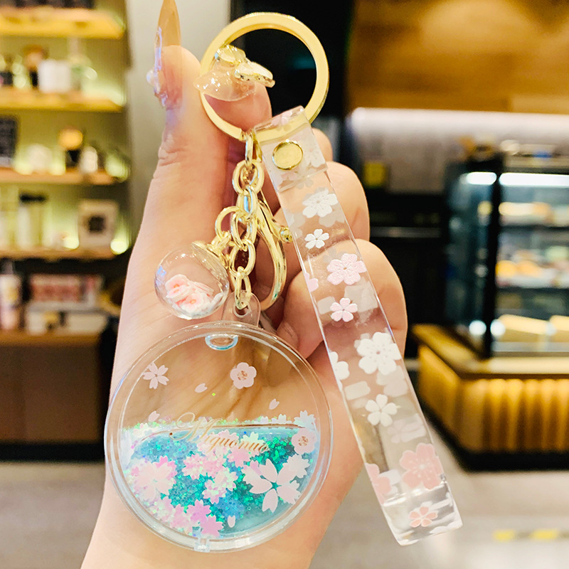 新しい桜キーホルダーアクリル移動液体流砂フラワーボトル