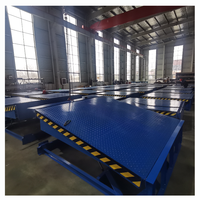 Nouveau pont d'embarquement de niveleur de quai télescopique de 8 tonnes de haute sécurité avec niveleur de quai fixe à moteur de qualité pour une utilisation en usine