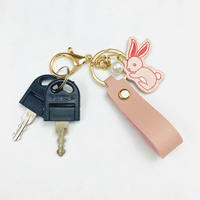 Porte-clés pendentif lapin charmant en cuir avec bracelet, style perle, fermoir doré pour sac à dos et sac à main