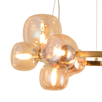 Lustre suspendu moderne Nicoletta de qualité supérieure à 11 lumières, 4000K, en fer doré avec cristaux ambrés, design élégant pour la maison et le bureau