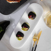 Buffet salle à manger porcelaine vaisselle vaisselle vaisselle en relief pierre Grain Sushi plateau Oblong noir mat plateau à Dessert en céramique