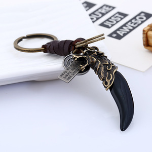 Chaveiro de Resina Wolf Tooth para Homens, Pingente de Bolsa Vintage em Liga de Bronze Antigo com Couro Trançado, Preto e Amarelo - Product Image 2
