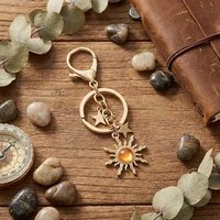 Porte-clés pendentif unisexe en alliage de zinc, motif étoile et soleil ajouré, électroplaqué, accessoire de sac et de bagage, style mode
