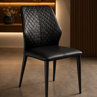 Chaises de salle à manger texturées à dossier fini en noir suie, avec pieds en métal élancés et coussin d'assise moelleux, pour café artisanal et restaurant de jardin