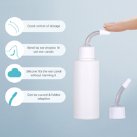 Bouteille de liquide de nettoyage d'oreille en HDPE en forme de cylindre à presser vide de 60ml 100ml avec applicateur de pointe d'aiguille en silicone Paquet d'utilisation de soins pour animaux de compagnie