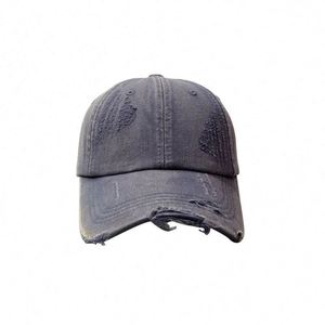 หมวกยีนส์วินเทจทรงเตี้ย ขอบหมวกดิ้นๆ ทรงไม่แข็ง ผ้าฝ้าย หมวกทรงแด๊ด วัสดุเดนิมฟอก หมวกเบสบอลขาดๆ สำหรับผู้หญิงและผู้ชาย - Product Image 6