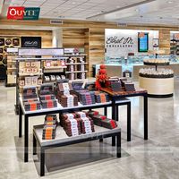Éclairage de magasin en libre-service à l'aéroport, comptoir en verre, vitrine à chocolat, table à bonbons, étagère en gondole, présentoir mural pour magasin à domicile