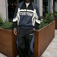 Ensemble survêtement homme style streetwear avec logo personnalisé brodé en nylon, coupe-vent et pantalon de jogging color block