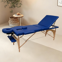 Dreiteilige, faltbare und verstellbare moderne Massageliege mit Holzgestell-Design, leicht und geeignet für das Wohnzimmer