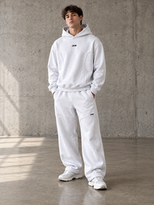 Conjunto de dos piezas para hombre Y2K: Sudadera con capucha gris jaspeado de paneles curvos y pantalones jogger de ajuste holgado con cordón, de tejido grueso. Venta al por mayor. - Product Image 1