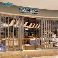 Vente en gros de porte électrique en alliage d'aluminium pour l'intérieur, avec volet roulant en cristal, porte coulissante pliable pour centre commercial, fabricant