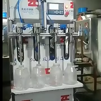 Machine de remplissage automatique de liquides en bouteille semi-automatique, prix de la machine, machine de remplissage à 4 têtes, machine d'emballage pour petites entreprises