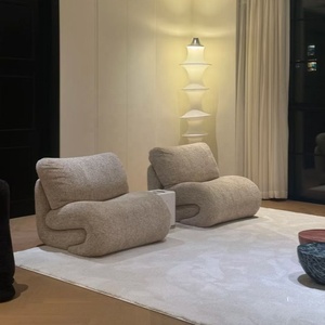 เก้าอี้ผ้าหุ้มทรงโค้งคล้ายงู พร้อมเบาะนุ่มสบาย ดีไซน์มินิมอลสไตล์วาบิซาบิ เหมาะสำหรับห้องนั่งเล่นที่อบอุ่น - Product Image 2