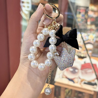 Pendentif porte-clés de luxe en forme de couronne avec perle et nœud, idéal pour téléphone, sac et clés de voiture, fabriqué en Chine