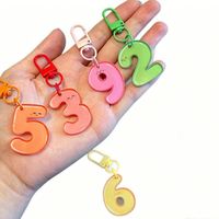 Porte-clés PVC et pendentif de sac en acrylique, design mignon et tendance, couleur bonbon, impression UV numérique arabe, vente en gros créative