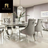 Table à manger de luxe moderne avec plateau en marbre noir et pieds en acier inoxydable doré pour meubles de salle à manger pour maison ou hôtel