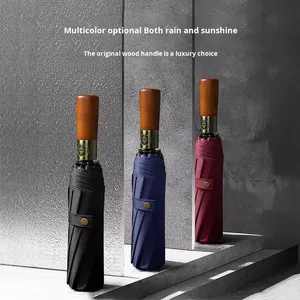 Manche en bois <span class=keywords><strong>Parapluie</strong></span> <span class=keywords><strong>pliant</strong></span> d'affaires <span class=keywords><strong>haut</strong></span> <span class=keywords><strong>de</strong></span> <span class=keywords><strong>gamme</strong></span> pour hommes 10 côtes Tube <span class=keywords><strong>de</strong></span> fer entièrement automatique 105cm Diamètre ouvert Revêtement noir - Product Image 2
