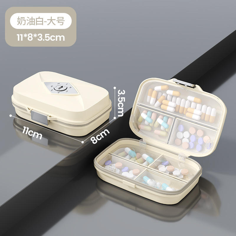 Caja grande de color (blanco crema) con 7 compartimentos y embalaje en inglés.