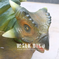 Sculpture de dinosaure animatronique de haute qualité en fibre de verre verte avec fonction résistante aux intempéries pour une utilisation en intérieur/extérieur
