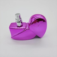 Vaporisateur de parfum en verre vide coloré en forme de coeur portable 25ml avec placage UV pour femmes