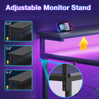 Bureau de jeu compact en fibre de carbone noir avec prises de courant réglables, support d'ordinateur LED en forme de L, étagères réversibles et design d'angle