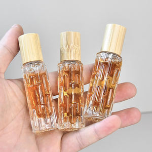 Bouteille à roulement à billes portable vide 10ml 15ml Bouteille d'huile essentielle unique avec surélevé sur la surface avec un couvercle en bois - Product Image 3