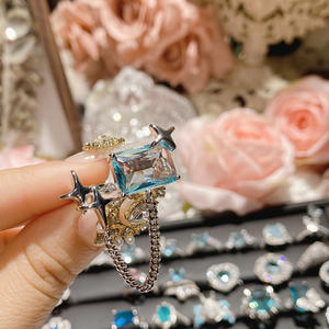 خاتم نسائي فاخر مطلي بالذهب ومرصع بالزركون، خاتم خطوبة أنيق بحجر أزرق ماسي - Product Image 1