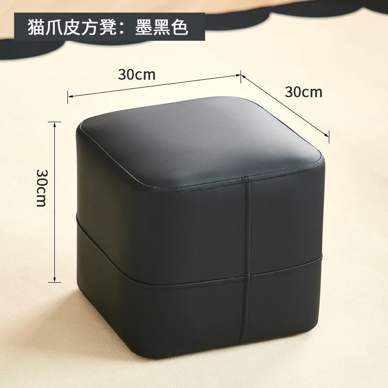 Taburete negro oscuro 3D con forma de cruz y cuero resistente a arañazos de gato.