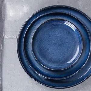 Vajilla de porcelana de diseño creativo para el hogar, platos de cerámica redondos azules variables de arte para decoración de boda, plato de postre de fiesta