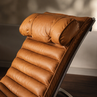 Fauteuil lounge mi-siècle en cuir vintage avec structure en acier inoxydable poli, fauteuil d'appoint pour salon