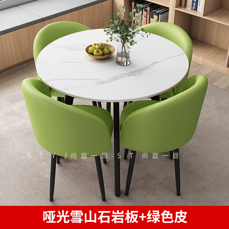 Tavolo in ardesia opaca da 80 cm + 4 sedie, rivestite in pelle verde chiaro.