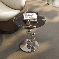 Table basse moderne de luxe en pierre avec structure métallique, design écologique et durable pour salon et chambre