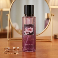 Brume parfumée pour femme, cylindrique, dégradé violet, capuchon doré, étiquette florale, boîte de présentation étoile de mer, fruitée, longue durée