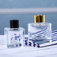 Vente en gros Bouteille vide en verre de diffuseur de parfum de forme ronde de couleur personnalisée transparente de 100ml 150ml 200ml avec couvercle