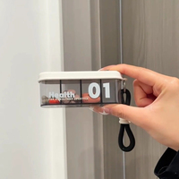 Nouvelle boîte à médicaments portable carrée en ABS, grande capacité, étanche à la poussière, pour les voyages, avec cordon
