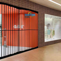 Fabrication en gros de porte coulissante pliante intelligente en alliage d'aluminium épaissi cloison silencieuse porte pliable pour centre commercial