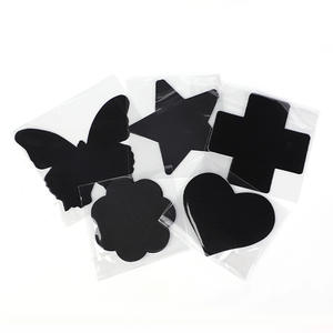 Cubiertas Adhesivas Desechables para Pezones, Color Negro, Diseño de Cruz, Talla Única - Product Image 1